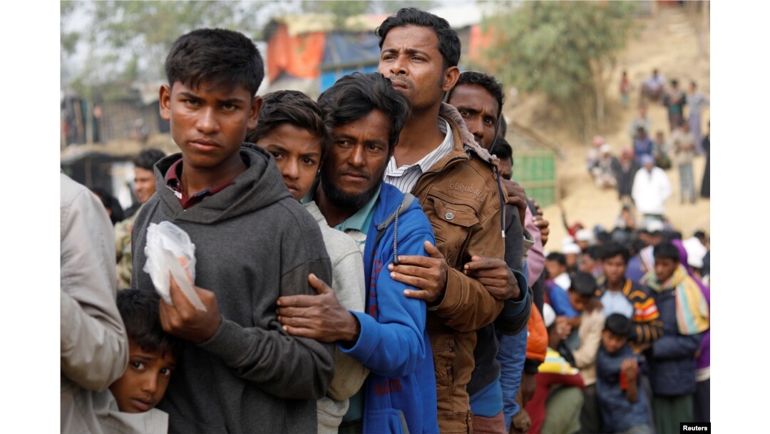 FILE - Rohingya refugees line up for daily essentials distribution at Balukhali camp, near Cox's Bazar, Bangladesh, Jan. 15, 2018.