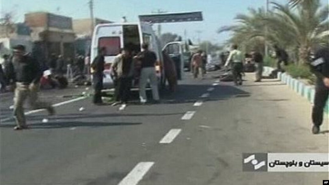 An ambulance attends the scene of a bomb blast in this image taken from TV, in Chahbahar, Iran, 15 Dec 2010