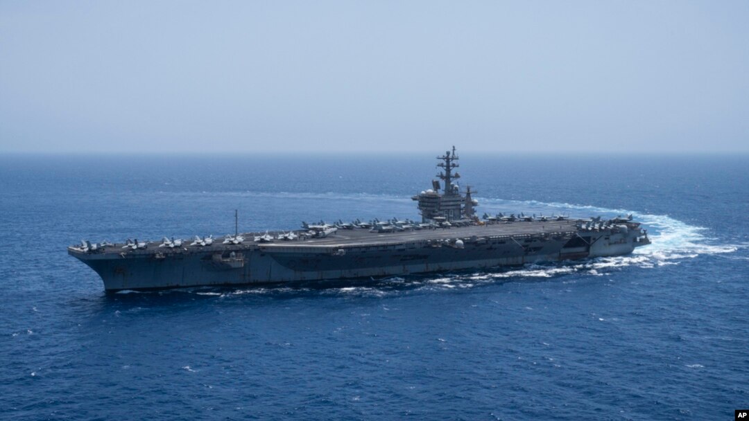 The USS aircraft carrier Dwight D. Eisenhower, also known as 'IKE', sails in the Red Sea on June 12, 2024. 