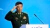 FILE - Chinese Defense Minister Li Shangfu salutes as he arrives to deliver his speech in Moscow, Russia, Aug. 15, 2023.