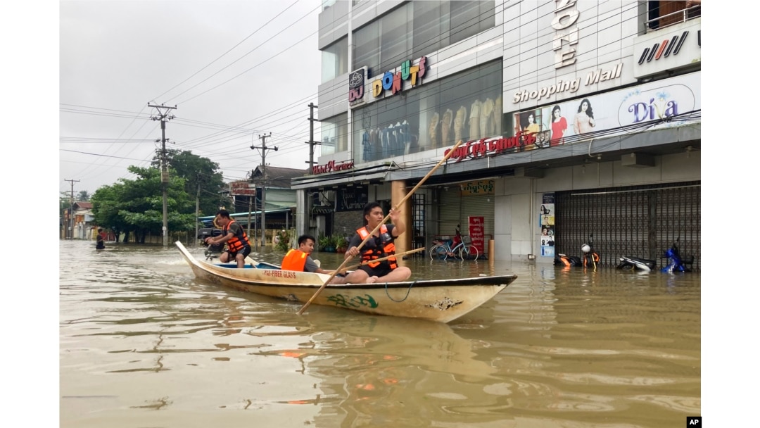 Volunteers use a boat on a flooded road in Bago, about 80 kilometers (50 miles) northeast of Yangon, Myanmar, Oct. 9, 2023.