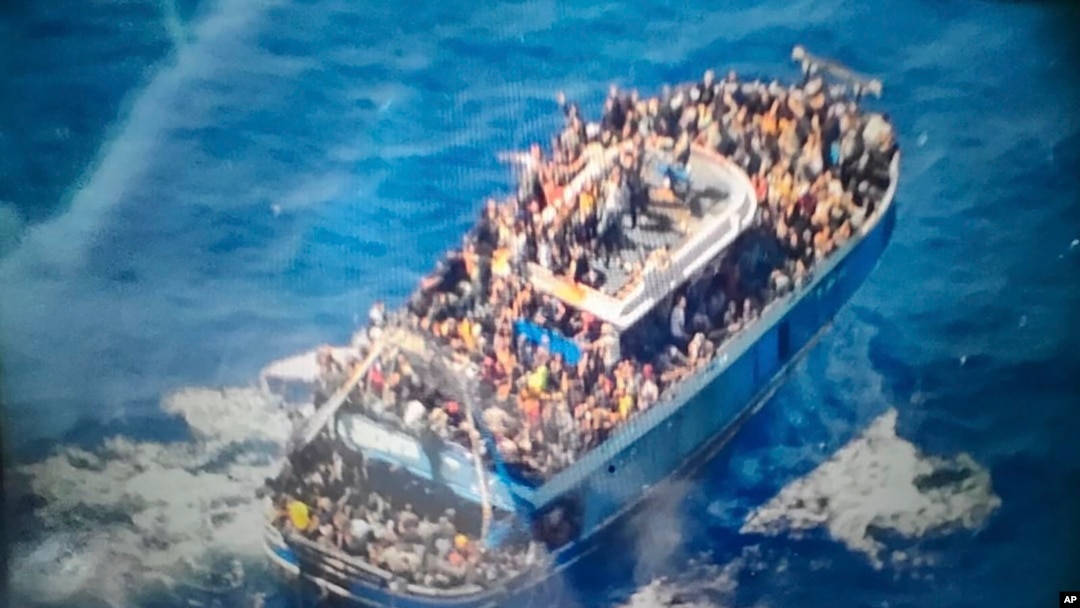 FILE - This undated handout image provided by Greece's coast guard on Wednesday, June 14, 2023, shows scores of people on a battered fishing boat, the Adriana, that later capsized and sank off southern Greece.