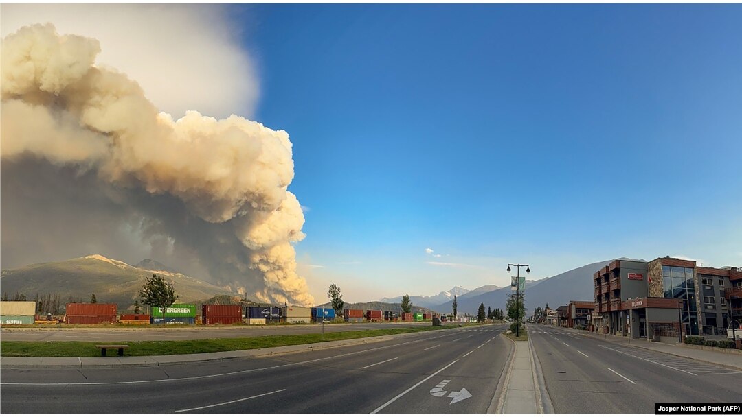 In this July 24, 2024, image obtained from the Jasper National Park in Canada, smoke rises from a wildfire burning in the park. (Handout/Jasper National Park/AFP)