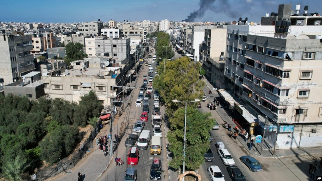 Palestinians flee from northern Gaza to the south after the Israeli army issued an unprecedented evacuation warning to a population of over 1 million people to seek refuge ahead of a possible Israeli ground invasion, Oct. 13, 2023. 