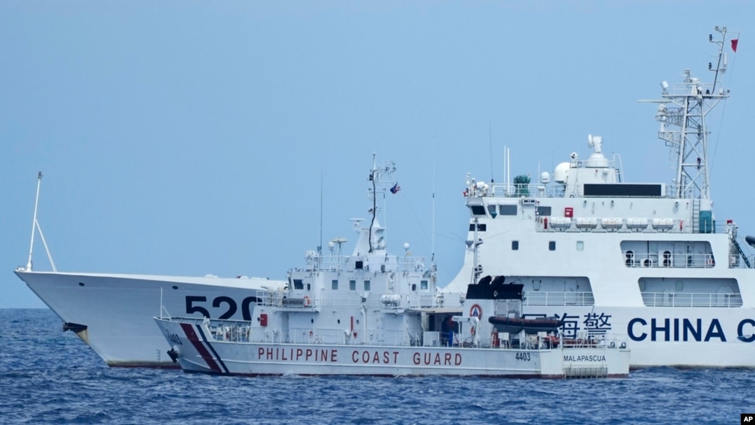 A Chinese coast guard ship with bow number 5201 blocks Philippine coast guard ship BRP Malapascua as it maneuvers to enter the mouth of the Second Thomas Shoal, locally known as Ayungin Shoal, at the South China Sea, April 23, 2023.