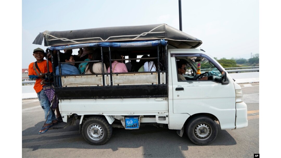 Myanmar residents cross the 1st Thai-Myanmar Friendship Bridge in Myawaddy district in eastern Myanmar, April 12, 2024.