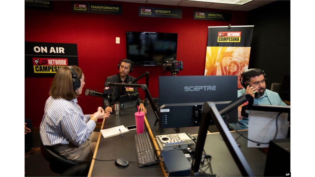 From left, guest Carolina Rodriguez-Greer with Mi Familia Vota, host Osvaldo Franco and engineer Daniel Orona broadcast from the Phoenix studio of Radio Campesina, a Spanish-language network, March 20, 2024.