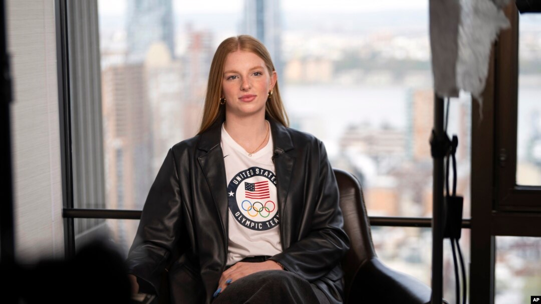 FILE - American swimmer Lydia Jacoby, 20, answers questions during an interview, Apr. 17, 2024, in New York. Jacoby was a breakout star in the pool at the last Summer Games, earning a gold medal in the 100-meter breaststroke and a relay silver.