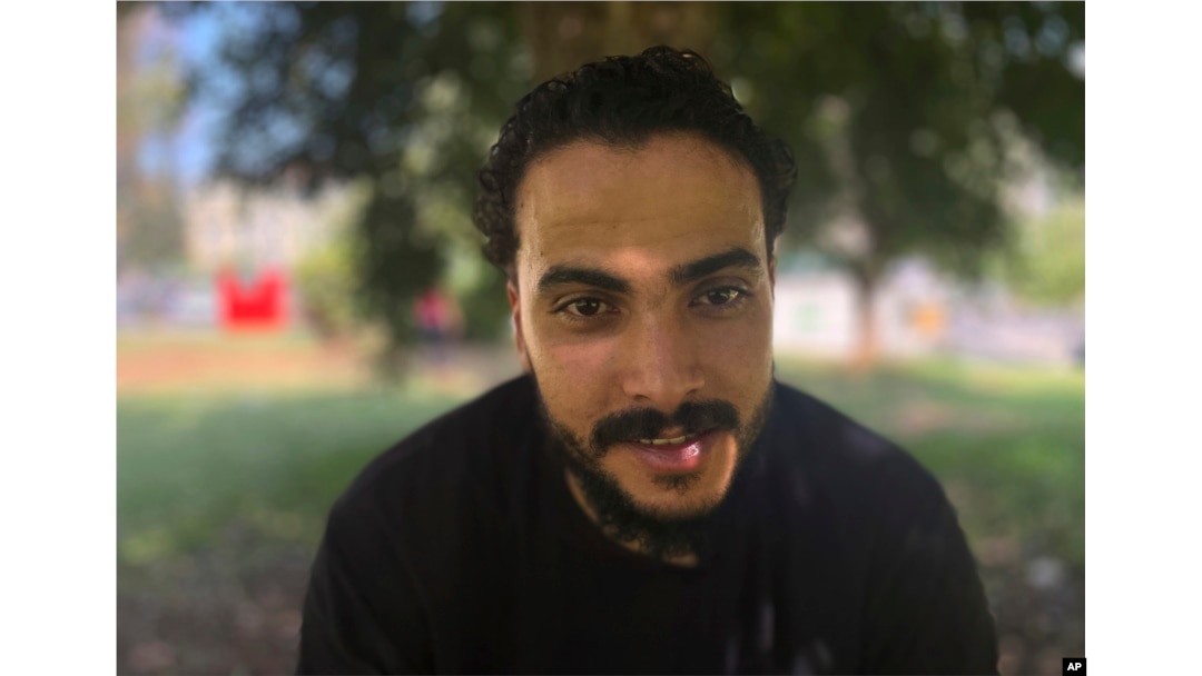 Ali Elwan of Egypt, who survived the sinking of a ship 1 year ago, poses for a photo after an interview with The Associated Press in Athens, June 7, 2024.