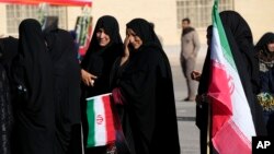People attend the funeral ceremony of the victims of a Jan. 3, 2024, bomb explosion in Kerman, Iran, about 820 kilometers (510 miles) southeast of the capital, Tehran, on Jan. 5, 2024.