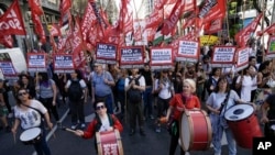 Marchers protest against economic measures taken by the government of Argentina's new president, Javier Milei, in Buenos Aires, Argentina, Dec. 20, 2023.