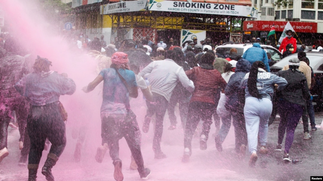People run after police use water cannon to disperse protesters during a demonstration against Kenya's proposed finance bill in Nairobi, Kenya, June 20, 2024.