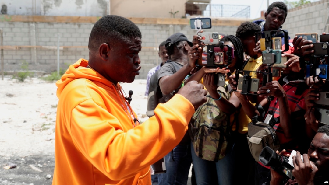 Jimmy Cherizier, the leader of the G9 et Famille gang, speaks to journalists in Delmas 6, a district of Port-au-Prince, Haiti, Aug. 16, 2023. 