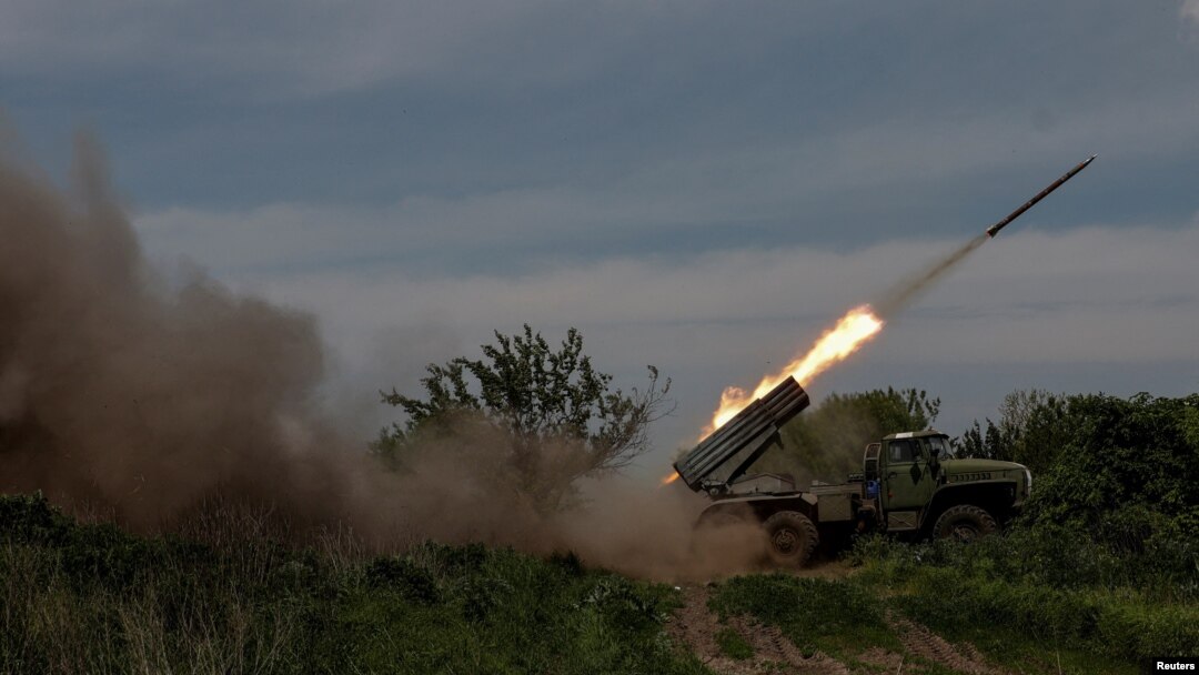 Ukrainian servicemen fire a BM-21 Grad multiple launch rocket system towards Russian troops during Russia's attack on Ukraine near the frontline town of Bakhmut, Ukraine, May 19, 2023. (Radio Free Europe/Radio Liberty/Serhii Nuzhnenko/Reuters)