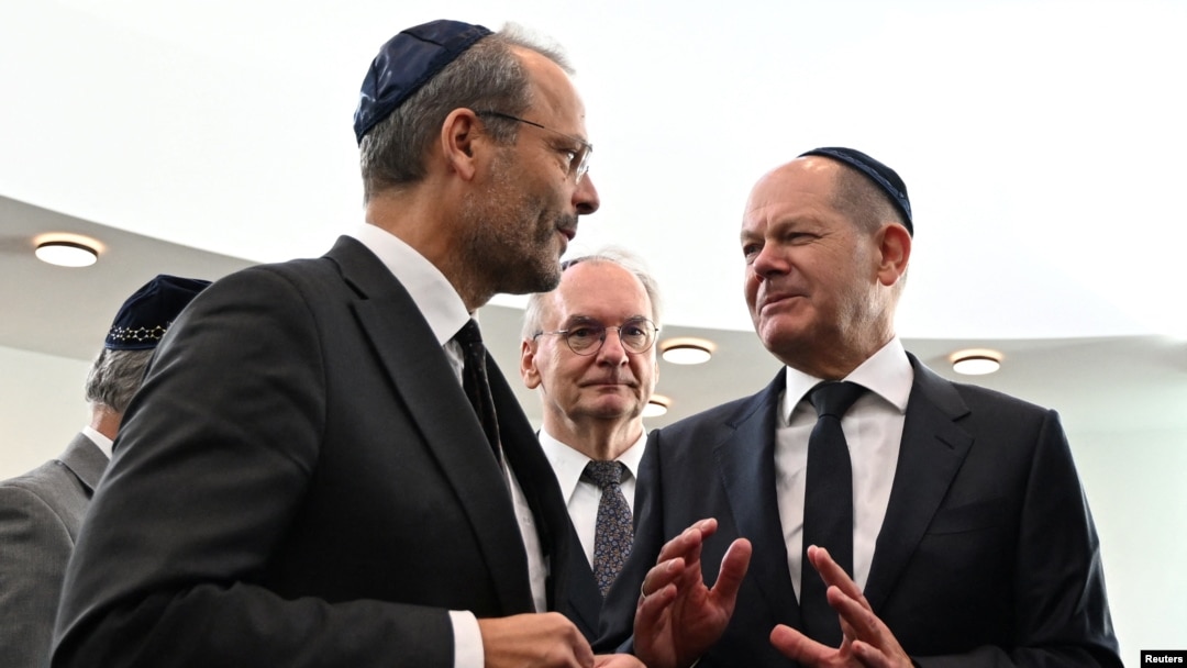 German Chancellor Olaf Scholz talks to Government Commissioner for Anti-Semitism Felix Klein during the inauguration of the newly built synagogue in Dessau Rosslau, Oct. 22, 2023. (Hendrik Schmidt/Pool via Reuters)