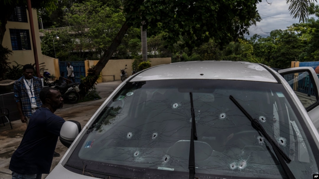 Bullet holes cover the windshield of journalist Roberson Alphonse's car after he was attacked in Port-au-Prince, Haiti, on Oct. 25, 2022. Alphonse, who works at the newspaper Le Nouvelliste and radio station Magik9, is hospitalized and said to be in stable condition.