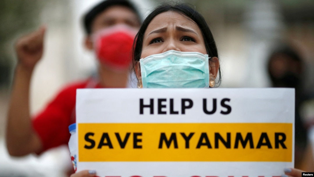 FILE - Myanmar citizens protest against the military coup in front of the UN office in Bangkok, Thailand Feb. 17, 2021.