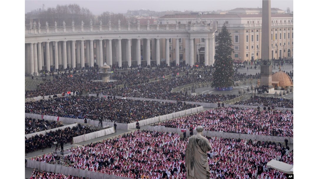 Faithful attend the funeral mass for late Pope Emeritus Benedict XVI in St. Peter's Square at the Vatican, Jan. 5, 2023. (AP Photo/Ben Curtis)