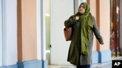 Batool Haidari, 37, walks to her Italian language class, in Rome, Dec. 5, 2022.