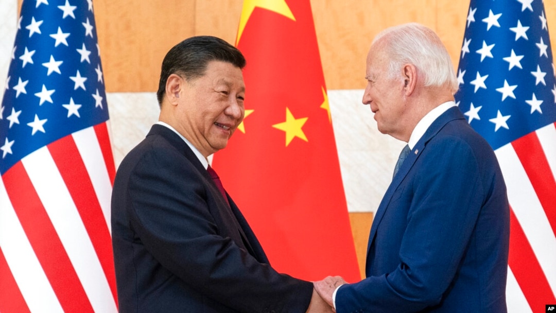 U.S. President Joe Biden, right, and Chinese President Xi Jinping shake hands before a meeting on the sidelines of the G-20 summit meeting, in Bali, Indonesia, Nov. 14, 2022.