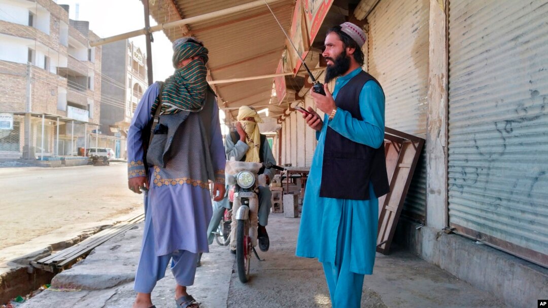 FILE - Taliban fighters patrol in Farah province, southwest of Kabul, Afghanistan, Aug. 11, 2021. Taliban rulers on Dec. 7, 2022, carried out the first public execution of a man charged with murder since returning to power. The execution took place at a stadium in Farah province.