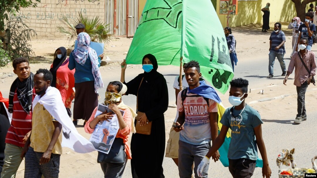 FILE - People attend a demonstration against the military coup, on International Women's Day in Khartoum, Sudan, March 8, 2022. 