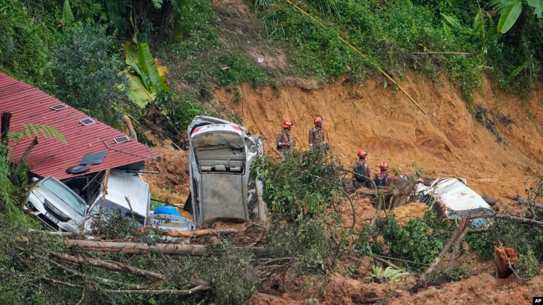 Rescue teams continue the search for victims caught in a landslide in Batang Kali, Malaysia, Dec. 17, 2022.