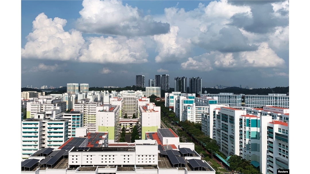 A view of public apartment blocks, with solar panels affixed to the roof of some blocks, in Singapore, June 27, 2019.