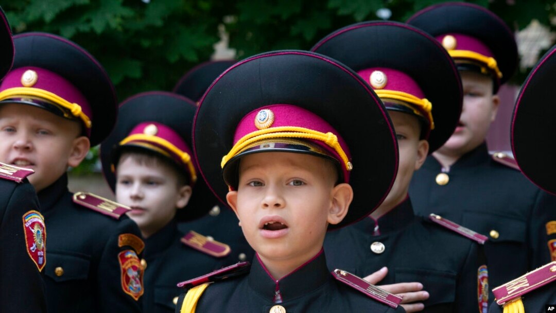 Young cadets sing the national anthem during rehearsal of a ceremony on the first day of school at a cadet lyceum in Kyiv, Ukraine, Sept. 1, 2022.