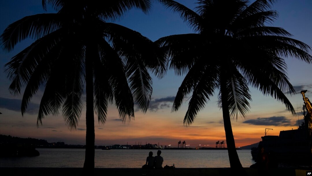 People enjoy the sunset inside what used to be America's largest overseas naval base at the Subic Bay Freeport Zone, Zambales province, northwest of Manila, Philippines on Feb. 6, 2023.
