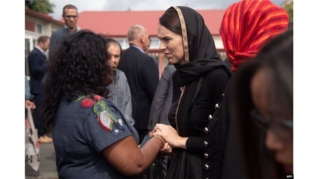 New Zealand Prime Minister Jacinda Ardern speaks with a woman during a visit to the Canterbury Refugee Center in Christchurch, March 16, 2019.