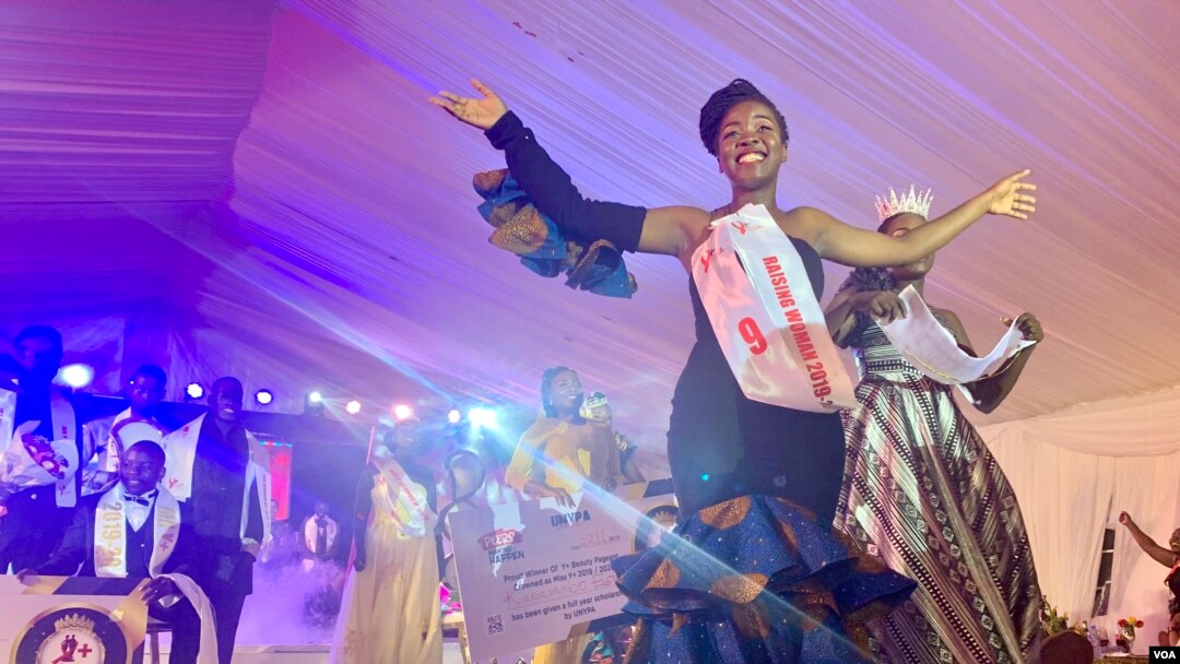 Kabasambo Esther, winner of the Miss Y+ Beauty Pageant 2019-2020, in Kampala, Uganda, waves to the audience, Nov. 22, 2019. (Halima Athumani/VOA)