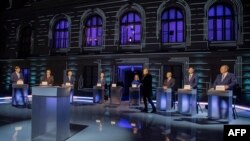 Candidates in the Czech presidential elections, left to right, Marek Hilser, Jaroslav Basta, Pavel Fischer, Petr Pavel, Danuse Nerudova, Josef Stredula, Karel Davis and Tomas Zima take part in the presidential debate on Czech TV on Jan. 8, 2023, in Prague.