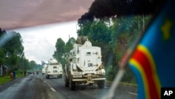 U.N. vehicles patrol the road leading to the front line in Goma, Democratic Republic of the Congo, Nov. 25, 2022.