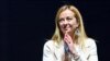 Brothers of Italy party leader Giorgia Meloni acknowledges applause after she delivered a speech on stage, Sept. 22, 2022, during a joint rally of Italy's right-wing parties Brothers of Italy, the League and Forza Italia, at Piazza del Popolo in Rome, ahe