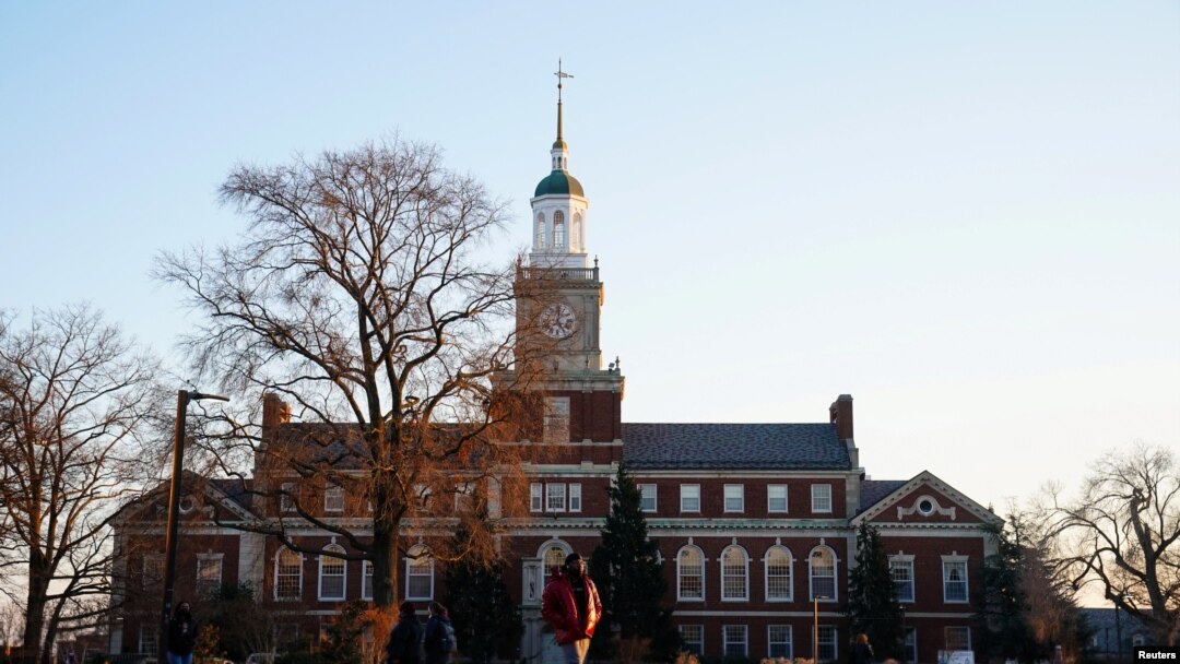 FILE - Students walk on the campus of Howard University, one of six historically Black colleges and universities (HBCUs) across the United States that received bomb threats, in Washington, Jan. 31, 2022.