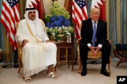 U.S. President Donald Trump, right, holds a bilateral meeting with Qatar's Emir Sheikh Tamim Bin Hamad Al-Thani, in Riyadh, Saudi Arabia, May 21, 2017.