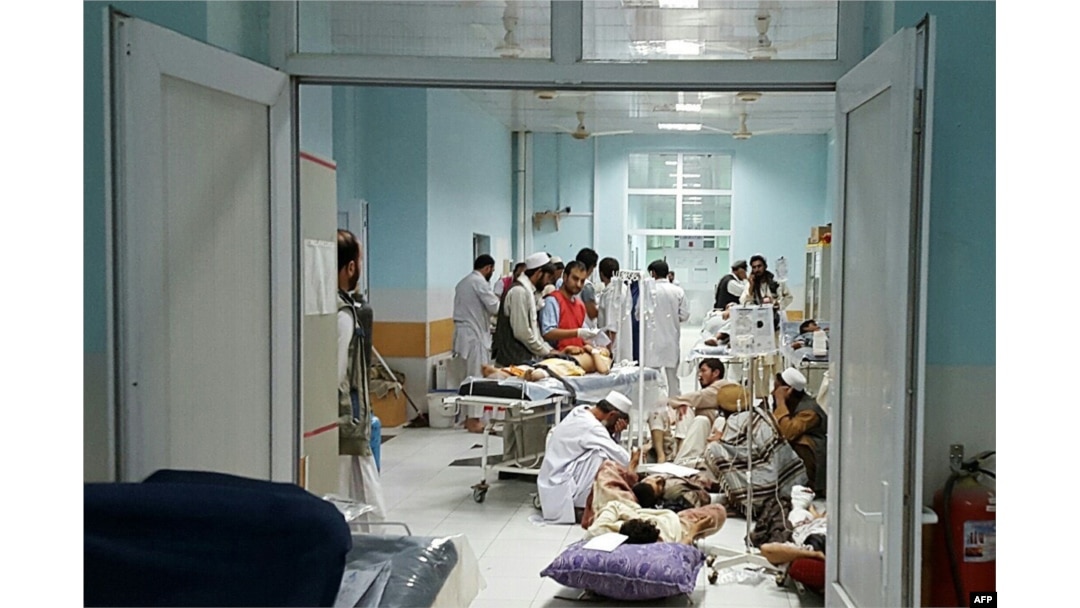 In this undated photograph released by Doctors Without Borders (MSF) on October 3, 2015, Afghan MSF medical personnel treat civilians injured following an offensive against Taliban militants by Afghan and coalition forces at the MSF hospital in Kunduz.