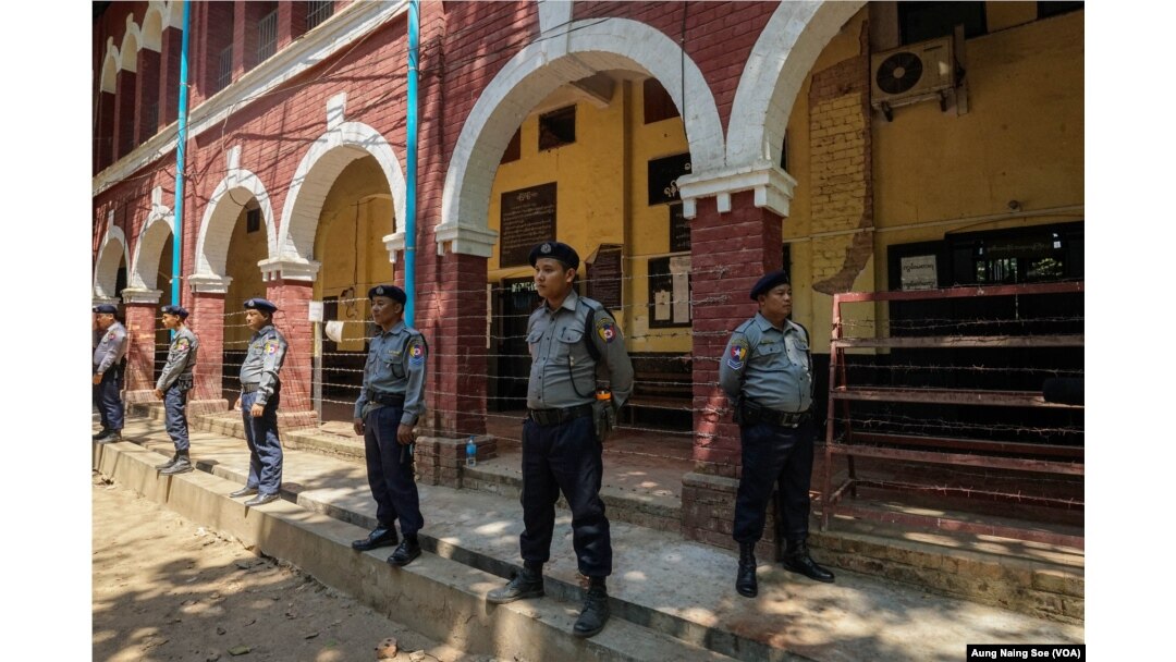 Police guard the courtroom in Yangon’s Insein Township where reporters Wa Lone and Kyaw Soe Oo are on trial.