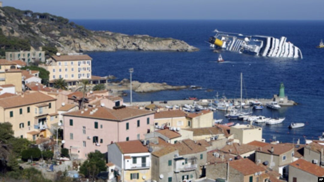 A cruise ship that ran aground is seen off the west coast of Italy at Giglio island, January 14, 2012.