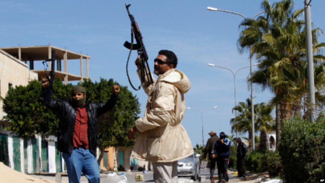 Gunmen opposed to leader Moammar Gadhafi holding their weapons are seen in the center of the city of Zawiyah, 50 km west of the capital Tripoli, March 5, 2011