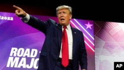 Former President Donald Trump points to the crowd as he leaves the stage after speaking at the Faith and Freedom Coalition’s 'Road to Majority' event, June 17, 2022, in Nashville, Tenn. 