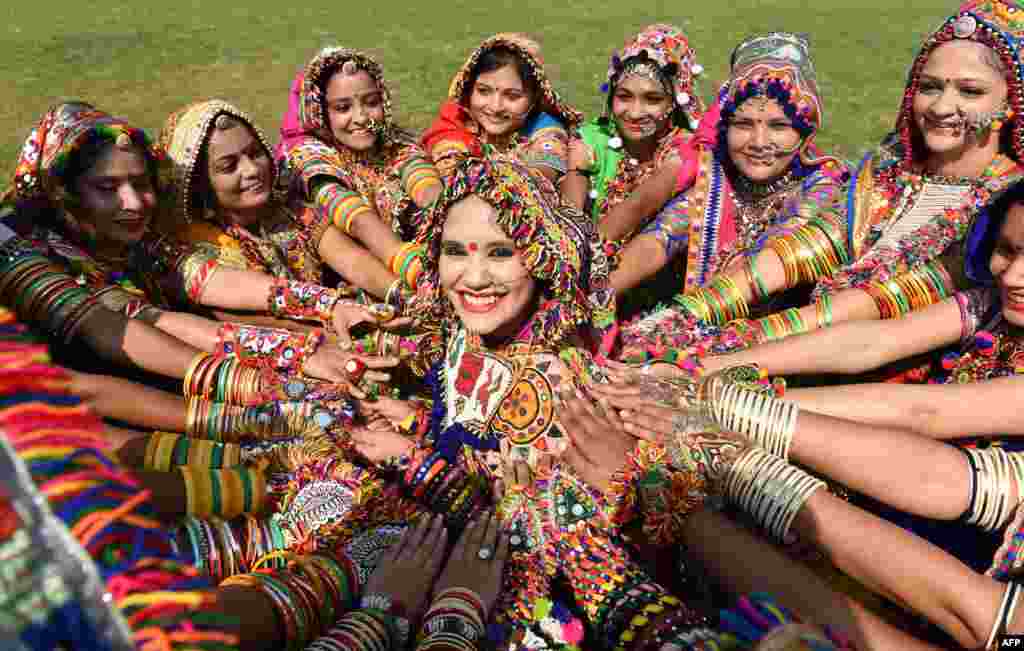 Abha Shah (C) Choreographer of Surtaal Performing Arts, and her group members participate in a 'Garba' dance rehearsal ahead of the forthcoming 'Navratri' festival on the outskirts of Ahmedabad, India.