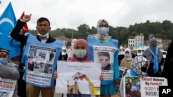 FILE - Members of Uyghur community living in Turkey stage a protest outside the Chinese consulate in Istanbul, June 2, 2021.
