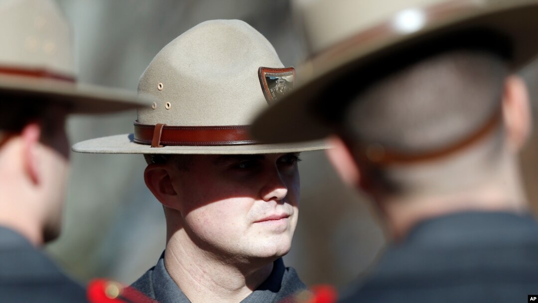FILE - Members of the Rhode Island State Police attend a ceremony at the State House in Providence, Rhode Island, Jan. 1, 2019.
