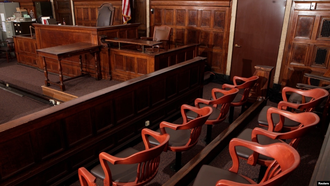 FILE -- A view of the jury box (front), where jurors would sit in and look towards the judge's chair (C), the witness stand (R) at the New York Supreme Court.