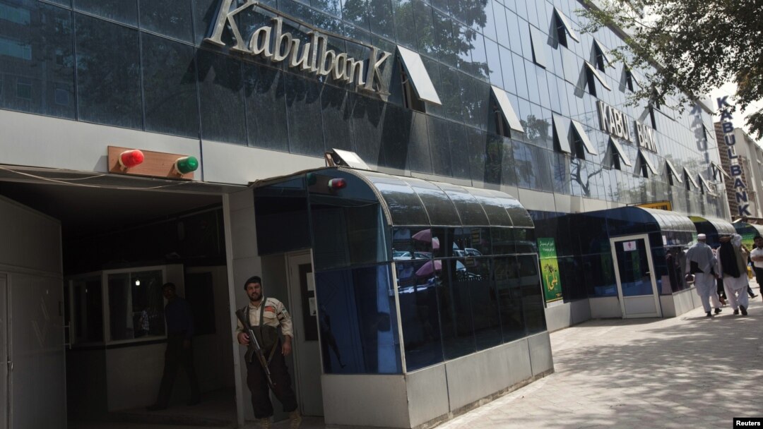 A security guard stands outside the main office of Kabul Bank, September 1, 2010. 