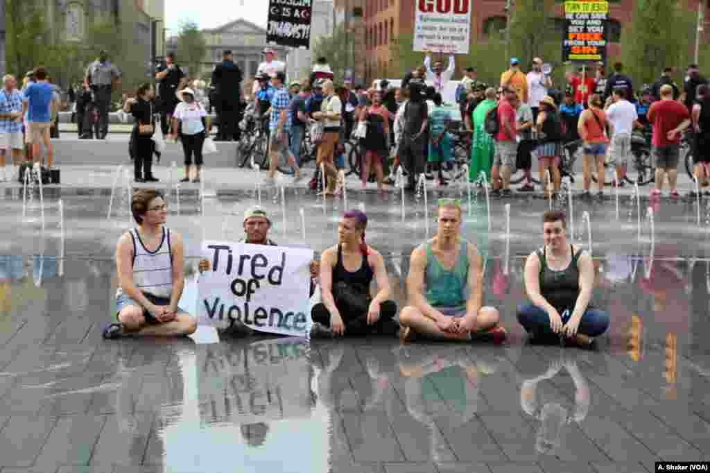 Protesters sit near Public Square during the Republican National Convention, in Cleveland, July 21, 2016.