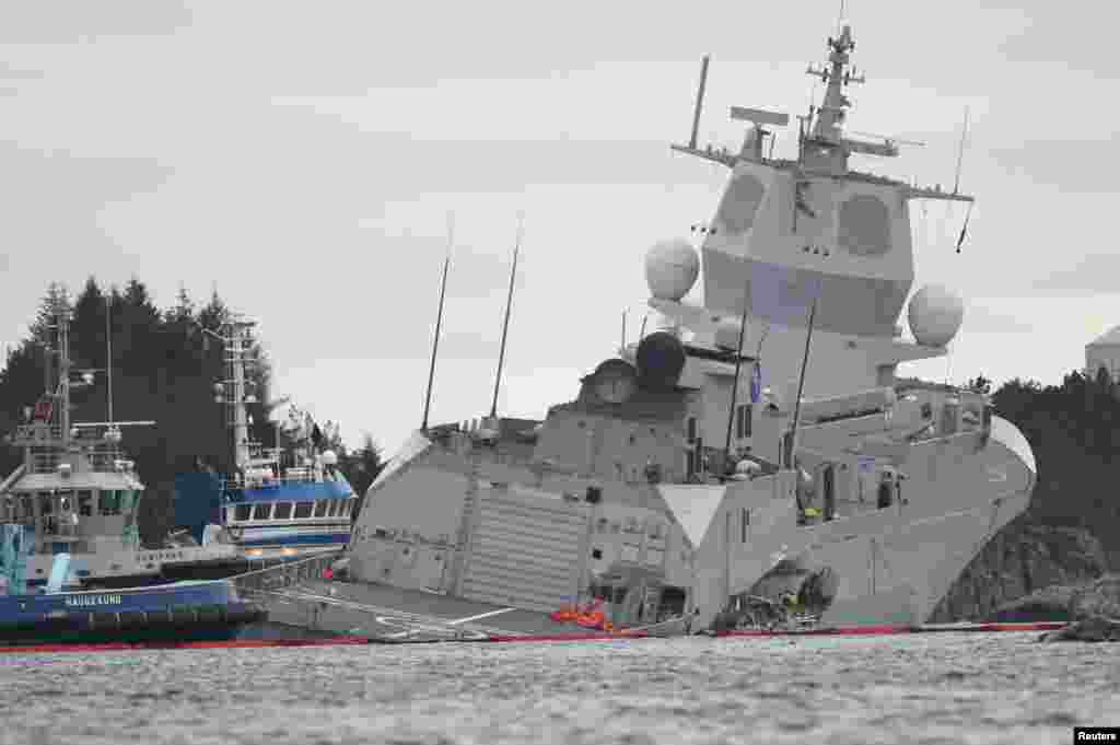 The Norwegian frigate "KNM Helge Ingstad" takes on water after a collision with the tanker "Sola TS" in Oygarden.