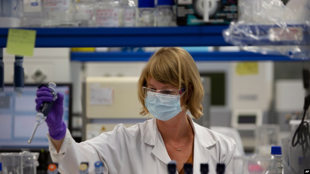 FILE - A lab technician works during research on the coronavirus, at Johnson & Johnson subsidiary Janssen Pharmaceutical in Beerse, Belgium, June 17, 2020.